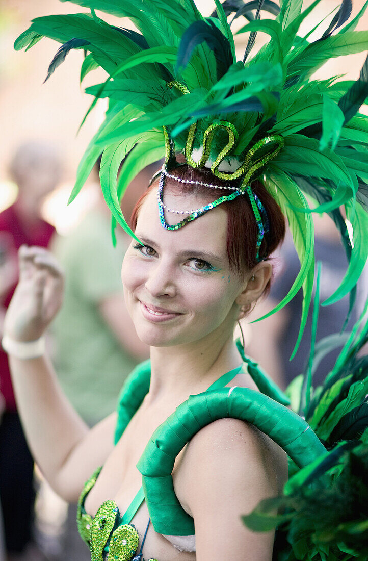 A dancer takes part in the parade of the Copenhagen Latin Carnival in Denmark. The Whitsun Carnival of Copenhagen is a very popular annual festival, drawing over 100,000 spectators a year. The highlight of the carnival are the two parades, but also notewo