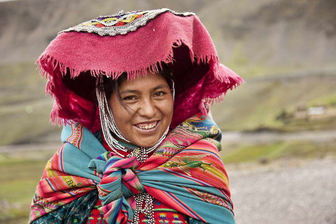 Young woman, named Maria, wearing traditional clothing in Peruvian Andes outside Cuzco, Peru, March 24, 2011