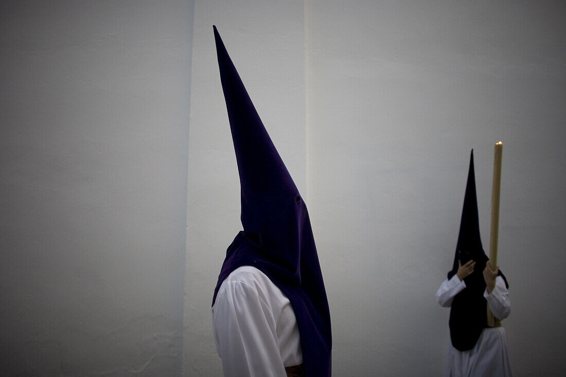 Penitents perform in an Easter Holy Week procession in Carmona village, Seville province, Andalusia, Spain, April 19, 2011.