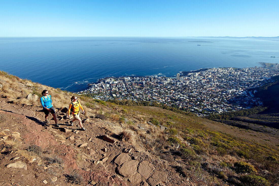 Katrin Schneider and Susann Scheller on a hike to the top of Lion's Head above the city of Cape Town. South Africa.