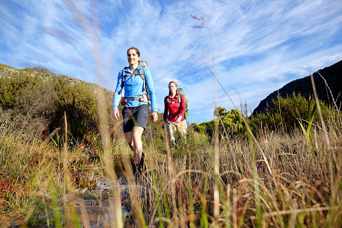 Katrin Schneider and Susann Scheller hiking on the Hoerikwaggo Trail from Cape Point to Table Mountain in Cape Town. South Africa.