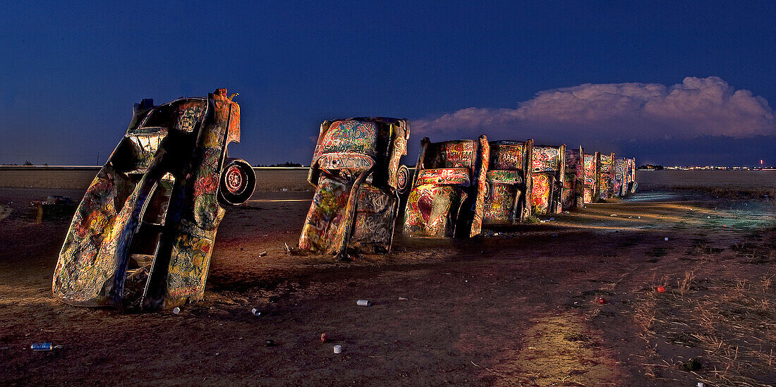 'West of Amarillo, Texas is this public art display called The Cadillac Ranch on I-40. It was created in 1974 by Chip Lord, Hudson Marquez and Doug Michels, who were a part of the art group Ant Farm, and it consists of what were when originally installed 