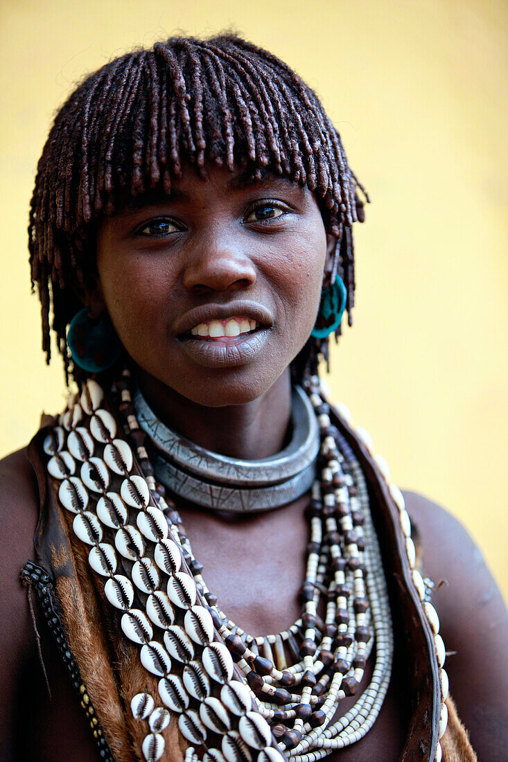Hamar are known for practice of body adornment and roll their locks with fat and red ochre assile, and than twist them into crimson-colored dreads called Goscha, a style that men find attractive.  Dimeka, Omo Valley, Ethiopia, 2010