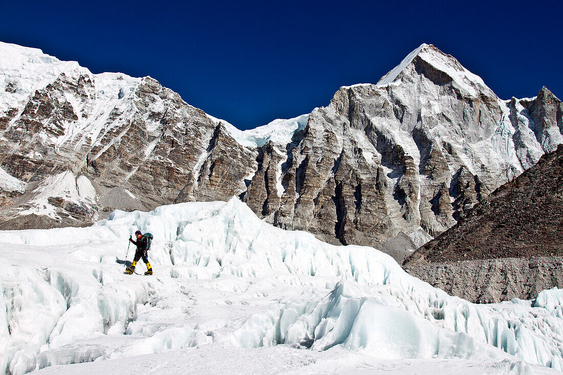 British Mountaineer Adele Pennington walks on the glacier below the Khumbu ice fall near to Everest Base Camp, Adele has twice guided clients to the summit of Everest.