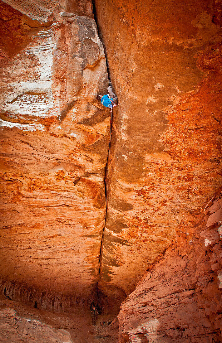 Tom Randall at the top of Century Crack, 5.14b, the hardest offwidth in the world, Canyonlands, Utah, USA..