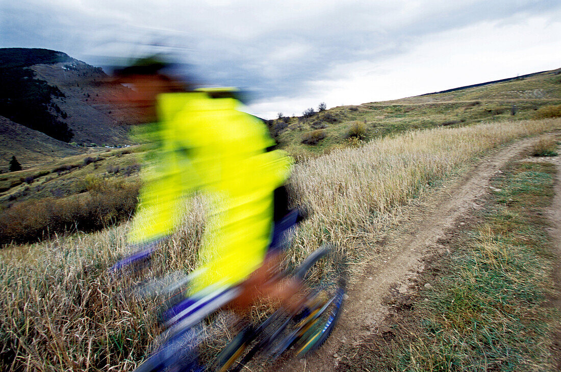Vicki Ward in motion on her mountain bike in Vail, Colorado