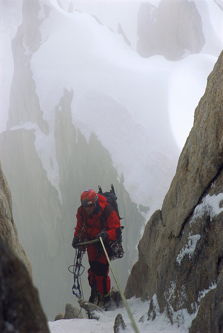 Conrad Anker, a world renown climber, rappels down the side of a K7 in stormy weather. Karakoram, Pakistan. Conrad spent 10 days battling the weather during his attempt to climb K7.