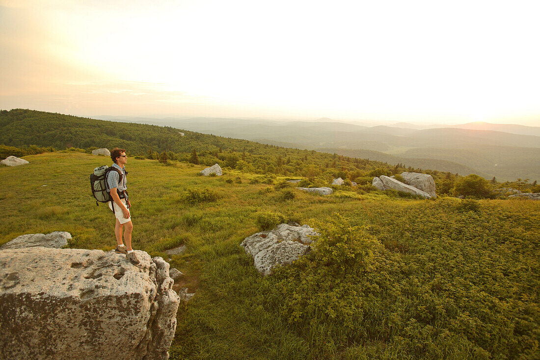 Harrison Shull checks out the sunset view from the Whispering Pines trail on the summit of Spruce Knob WV's highest point 4863ft, near Circleville, WV.