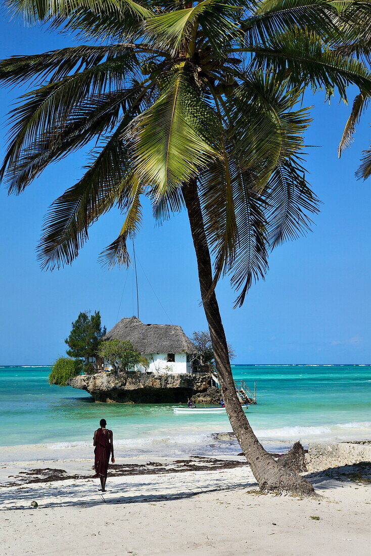 Masai tribesman on Bwejuu Beach, The Rock Restaurant, Zanzibar, Tanzania, Indian ocean, East Africa, Africa