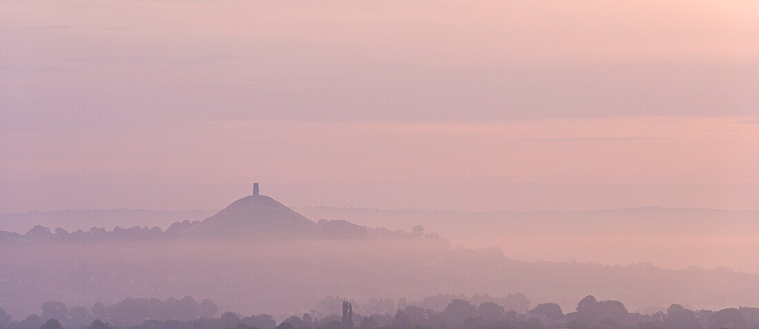 Glastonbury Tor on a misty morning in summer, Somerset, England, United Kingdom, Europe