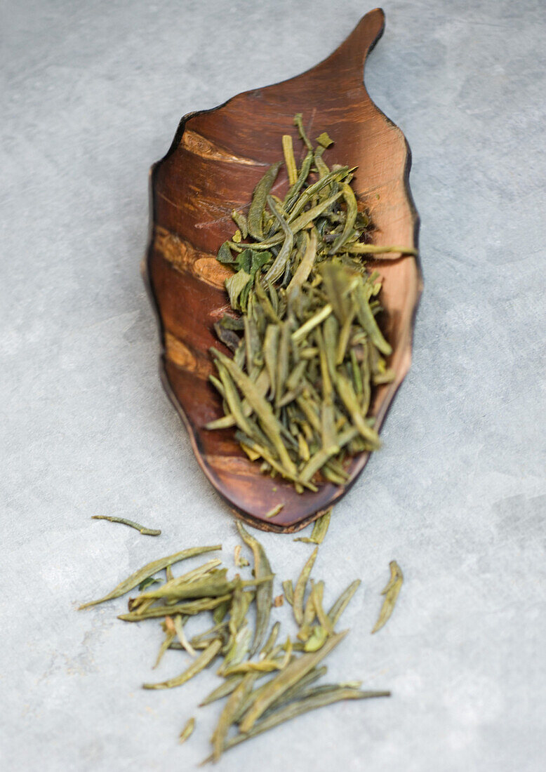 Green tea leaves in scoop