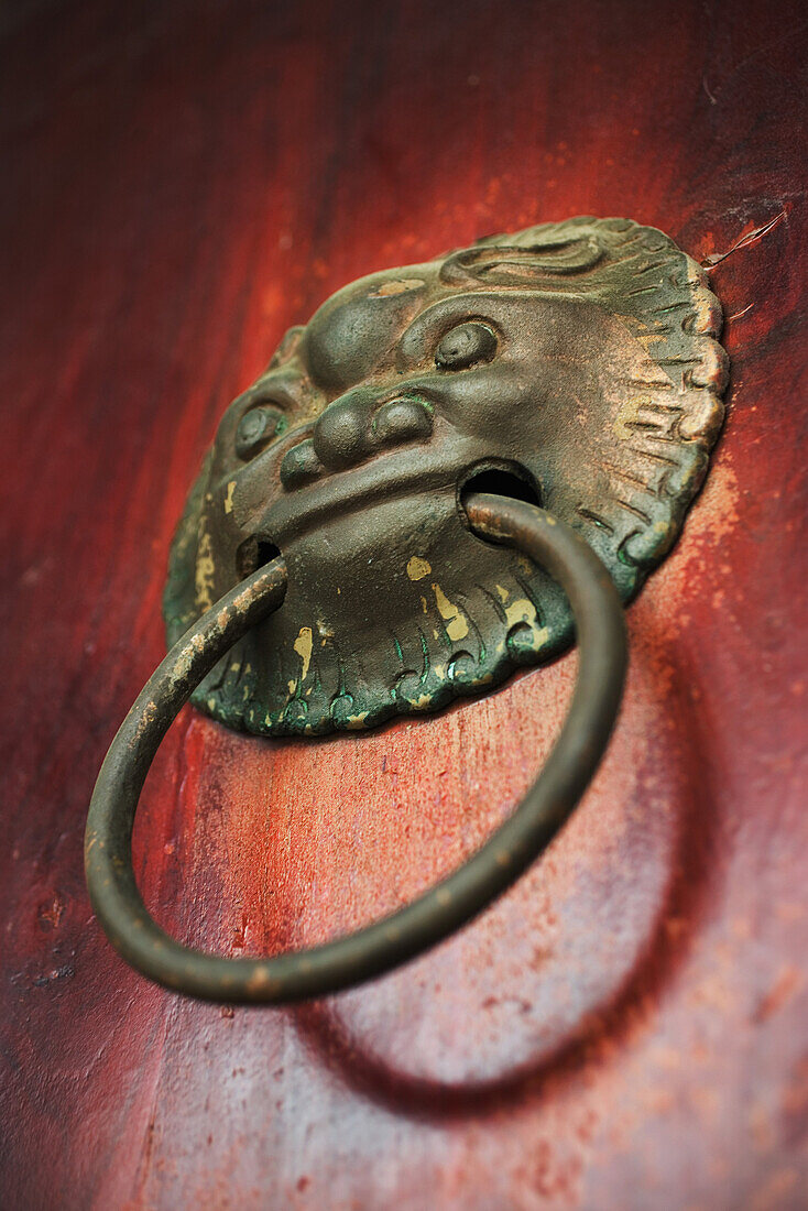 Chinese door knocker, low angle view, close-up
