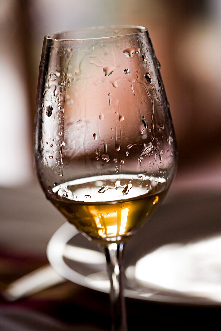 Tears of wine on glass of white wine