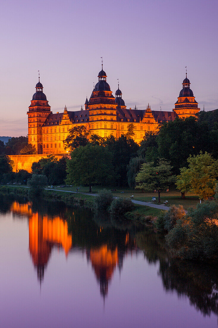 Johannisburg Palace and parklands along the Main river at dusk, Aschaffenburg, Franconia, Bavaria, Germany