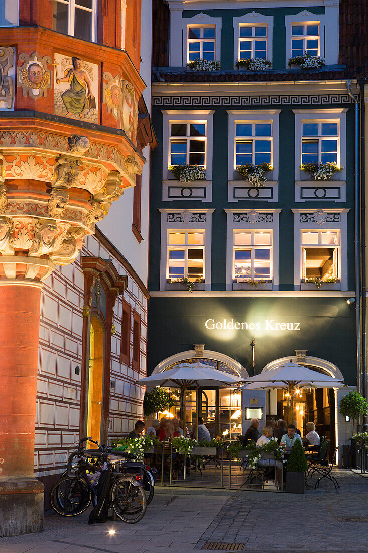 Coburger Erker at Stadthaus, former chancery building and Goldenes Kreuz restaurant at dusk, Coburg, Franconia, Bavaria, Germany