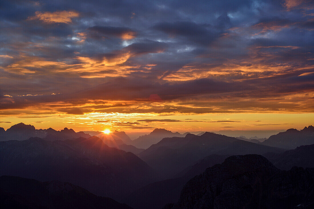 Sunrise over Dolomites with Marmolada, Antelao, Pelmo and Civetta, Rifugio Torre di Pisa, Latemar range, Dolomites, UNESCO world heritage Dolomites, Trentino, Italy