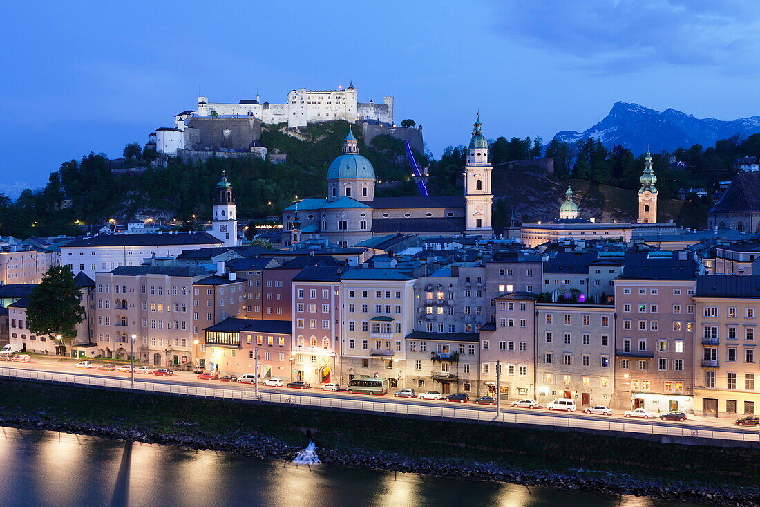 High angle view of the old town, UNESCO World Heritage Site, with Hohensalzburg Fortress, Dom Cathedral and Kappuzinerkirche Church at dusk, Salzburg, Salzburger Land, Austria, Europe