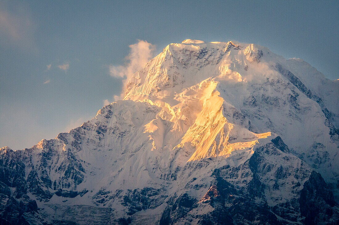 The evening sun on Annapurna South, 7219m, Annapurna Conservation Area, Nepal, Himalayas, Asia