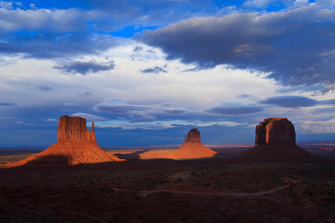 The Mittens at dusk cast long shadows, Monument Valley Navajo Tribal Park, Utah and Arizona border, United States of America, North America