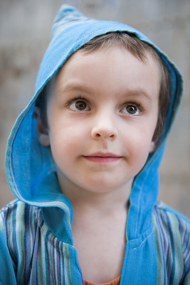 Little boy looking up in thought, portrait