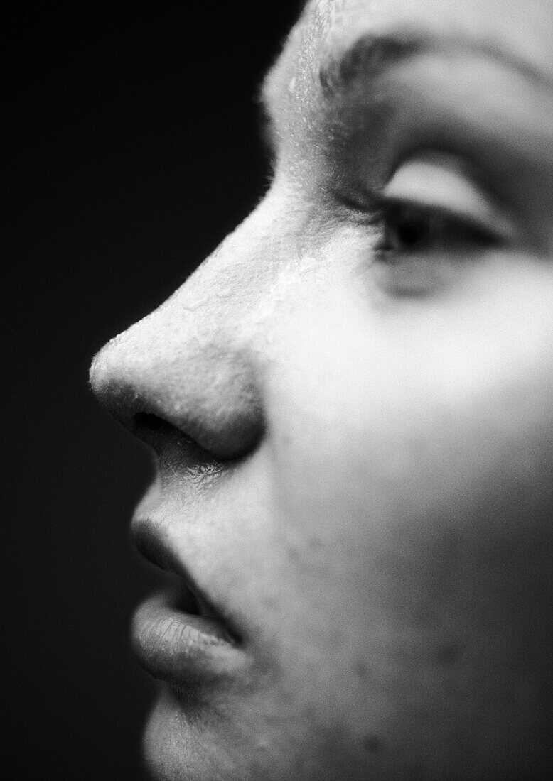 Woman's face, half-closed eyes, side view, close-up, B&W