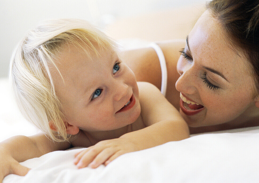 Woman smiling at baby, close-up