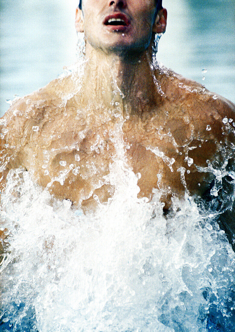 Man emerging from water, close-up