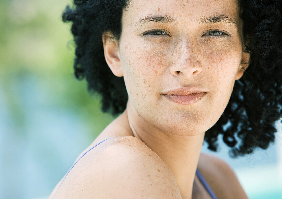 Young woman with freckles, portrait