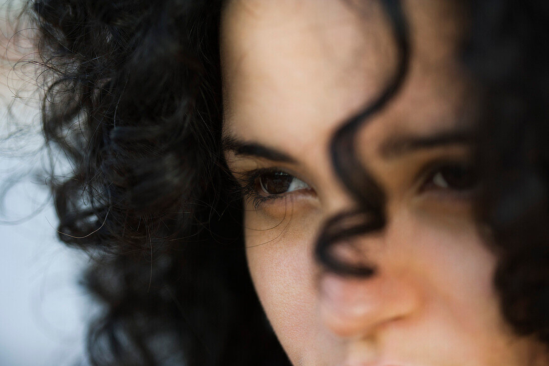 Young woman looking away, close-up