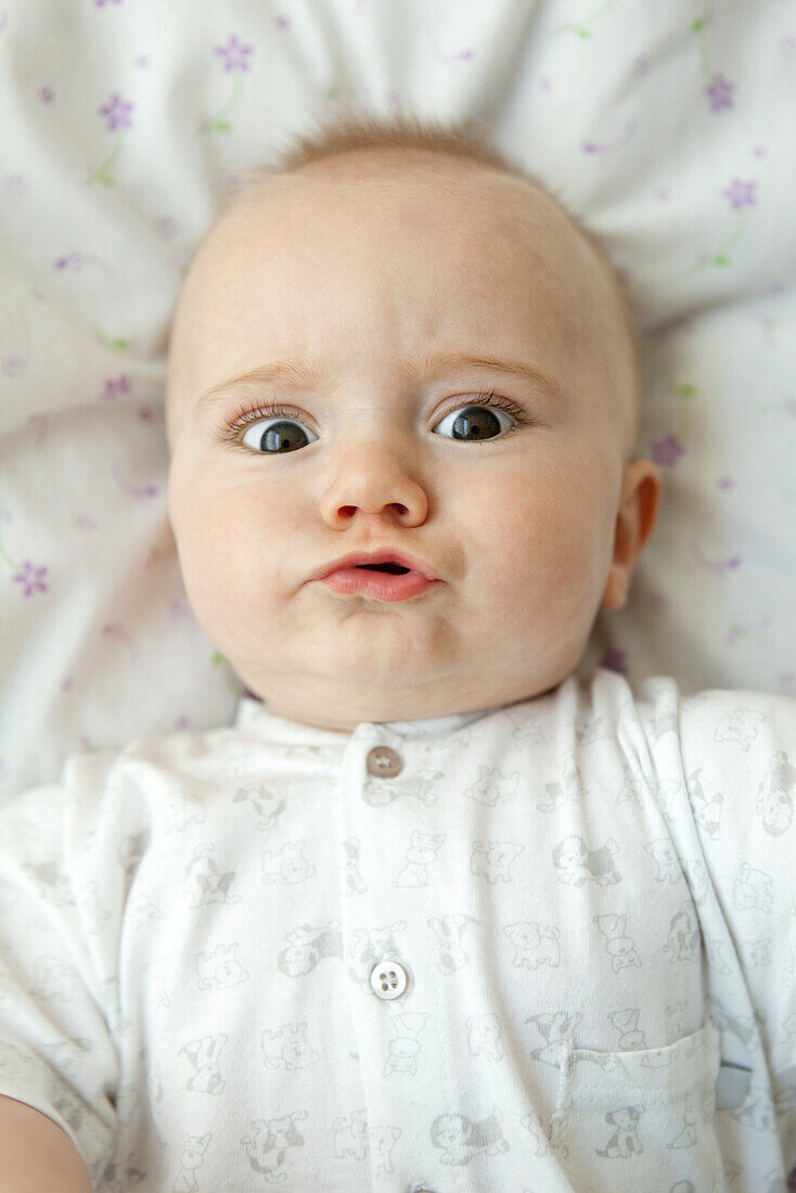 Baby making faces at camera, portrait