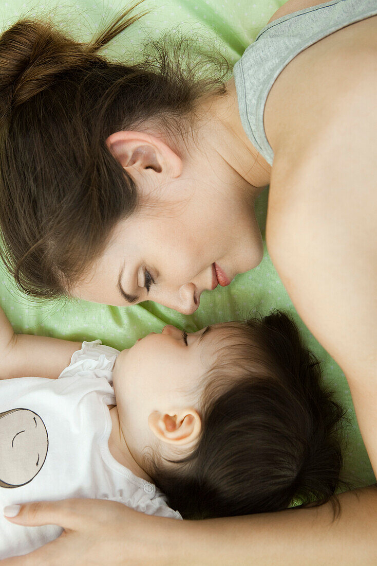 Mother and infant napping together