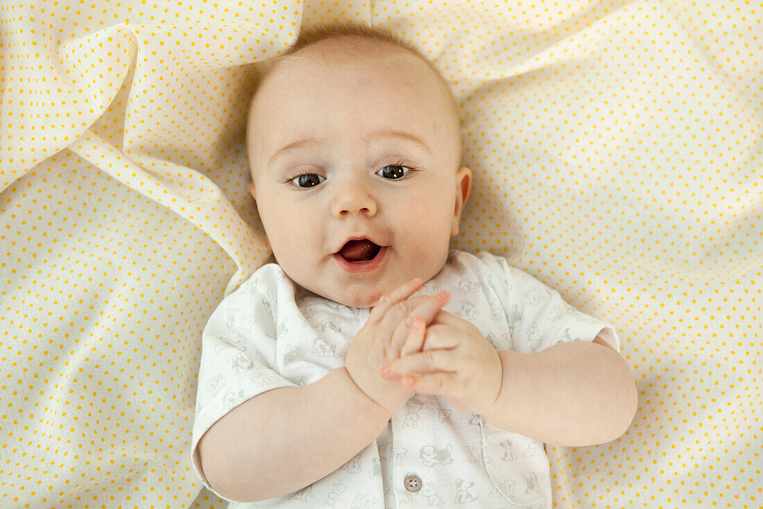 Baby with suprised expression, portrait