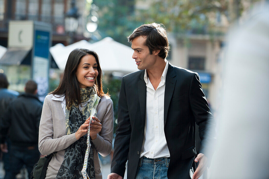 Couple walking and talking together outdoors