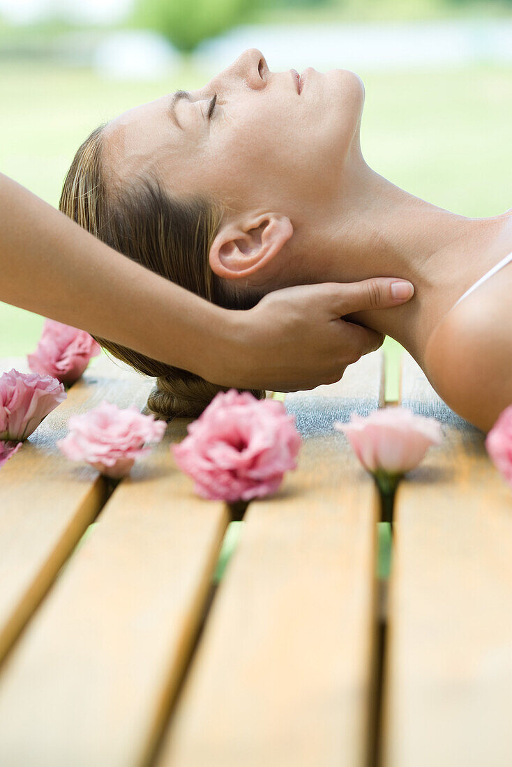 Woman receiving neck massage