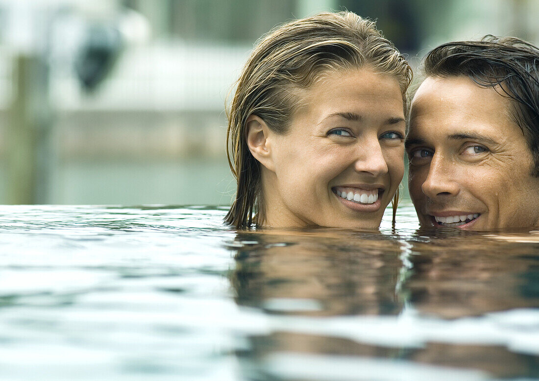 Couple smiling in pool