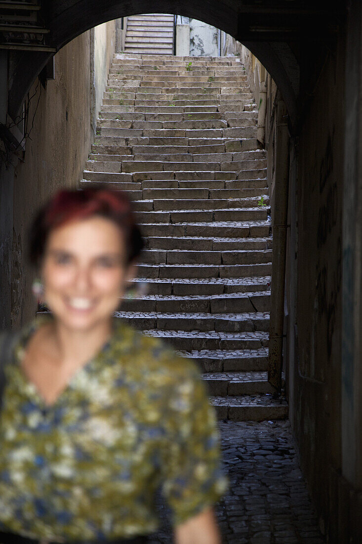 A woman in an alley, focus on background