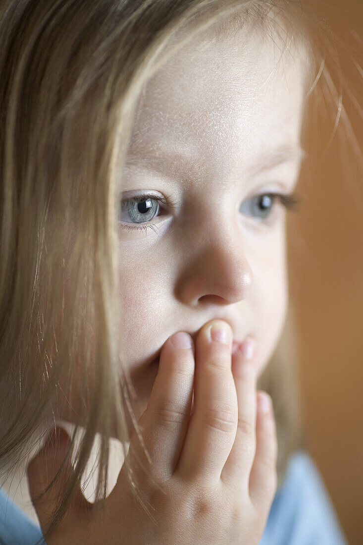 A toddler staring off camera