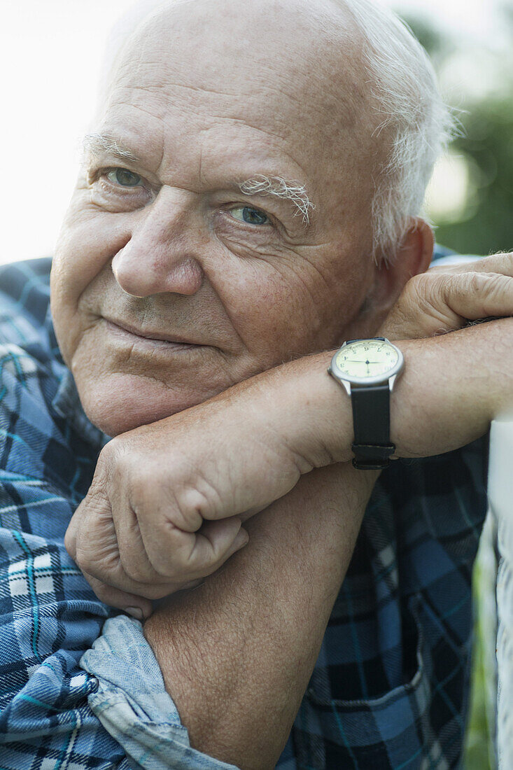 A senior man looking relaxed, close-up