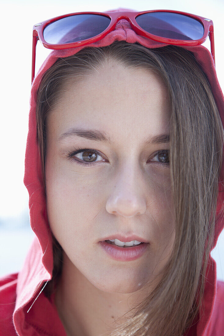 Portrait of girl in red hooded shirt