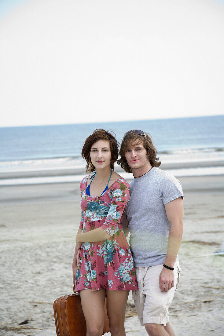 A young couple at the beach, portrait