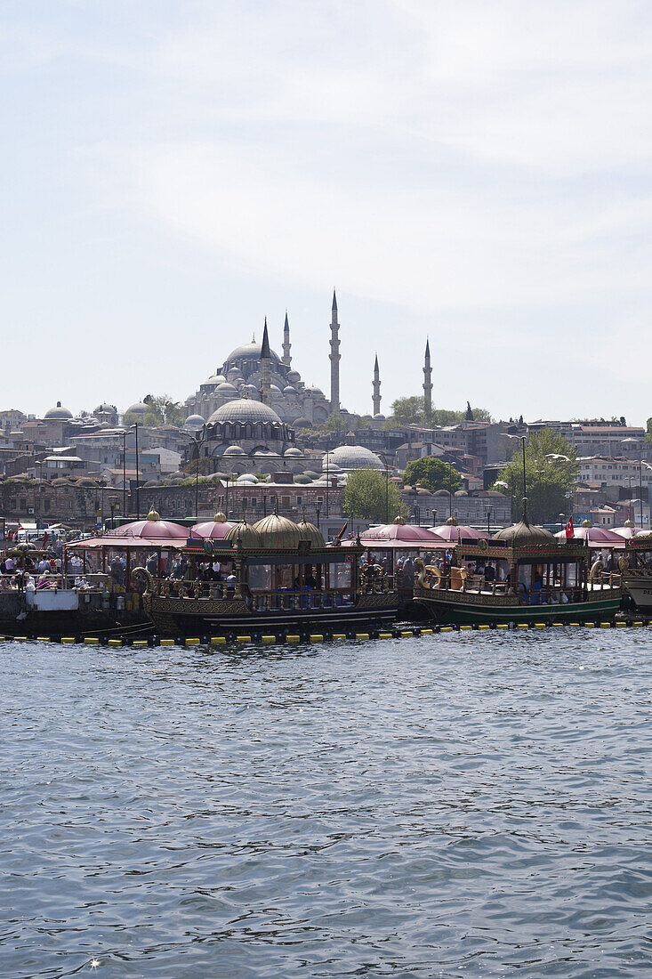 Tour boats on the Golden Horn River below the Suleymaniye Mosque, Istanbul, Turkey