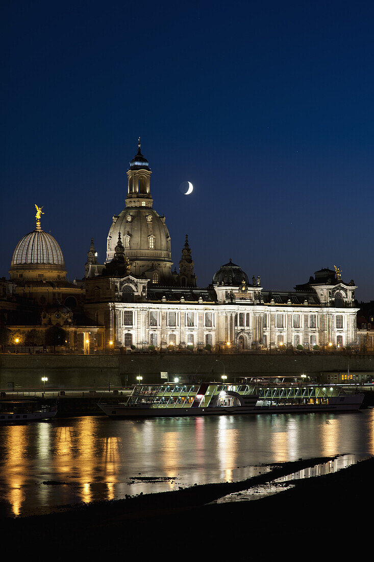 A tour boat on the Elbe River waterfront of Dresden, Germany