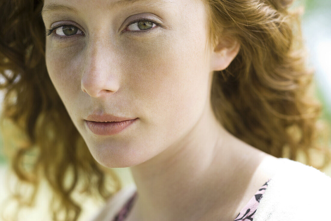 Young woman looking at camera, portrait