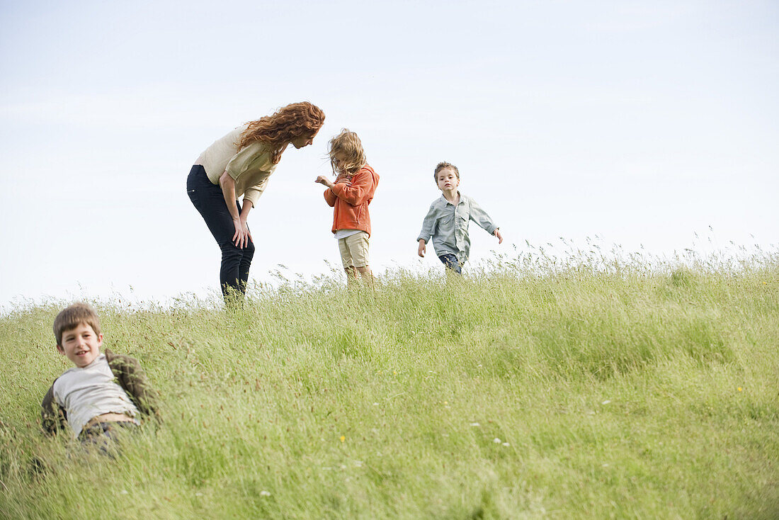 Mother consoling daughter outdoors