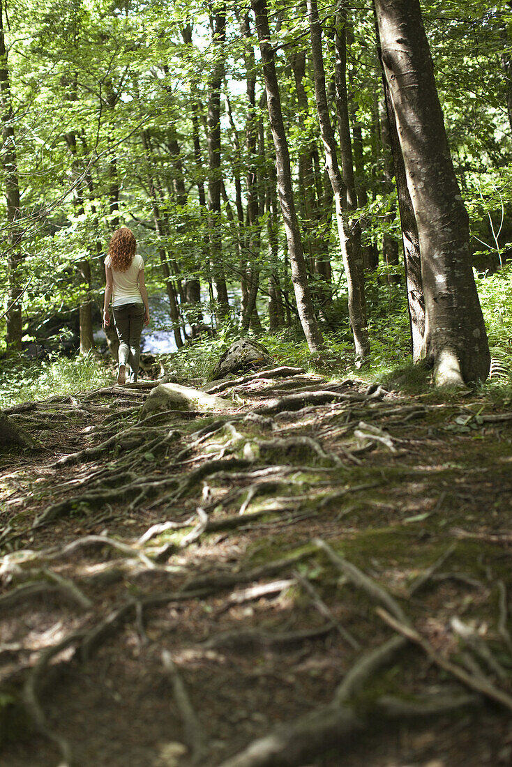 Woman walking in woods