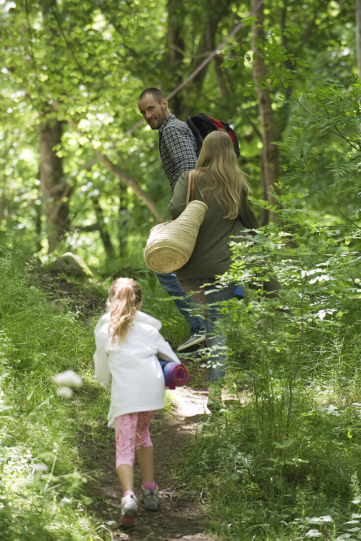 Family hiking together in woods