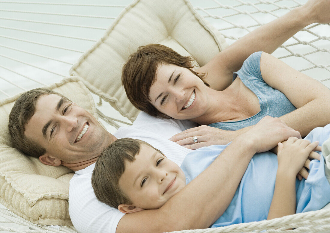 Family relaxing in hammock