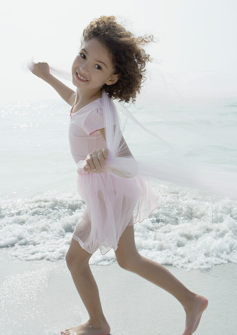 Girl playing on beach