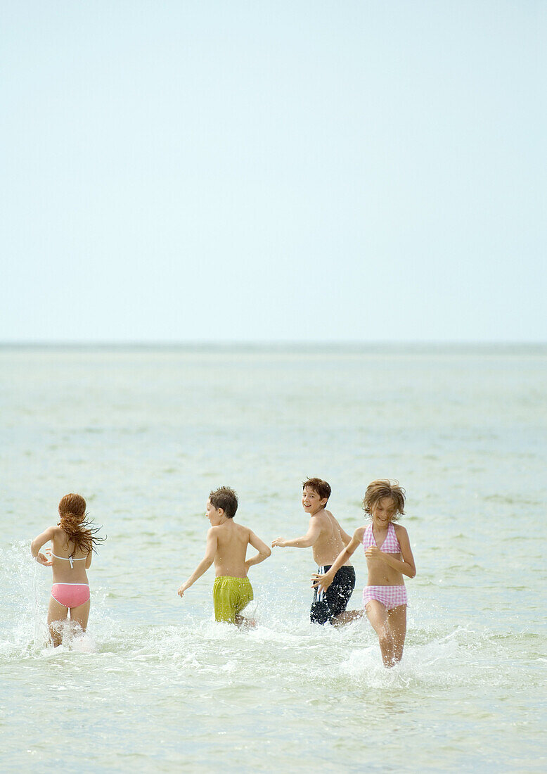 Children playing in sea