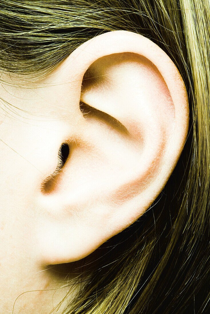 Teenage girl's ear, extreme close-up